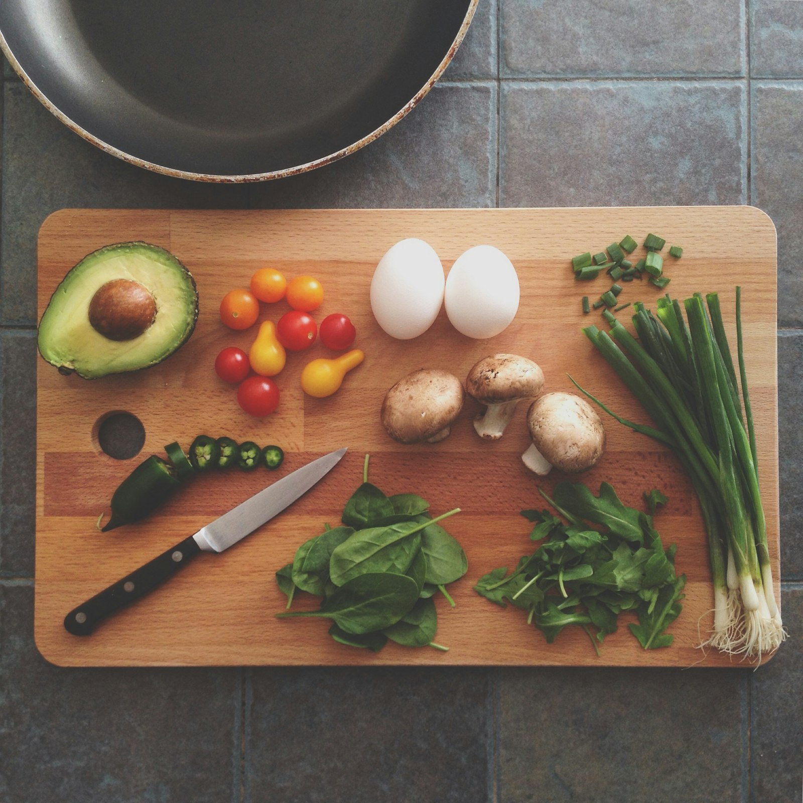 Fresh vegetables being prepped on a cutting board
